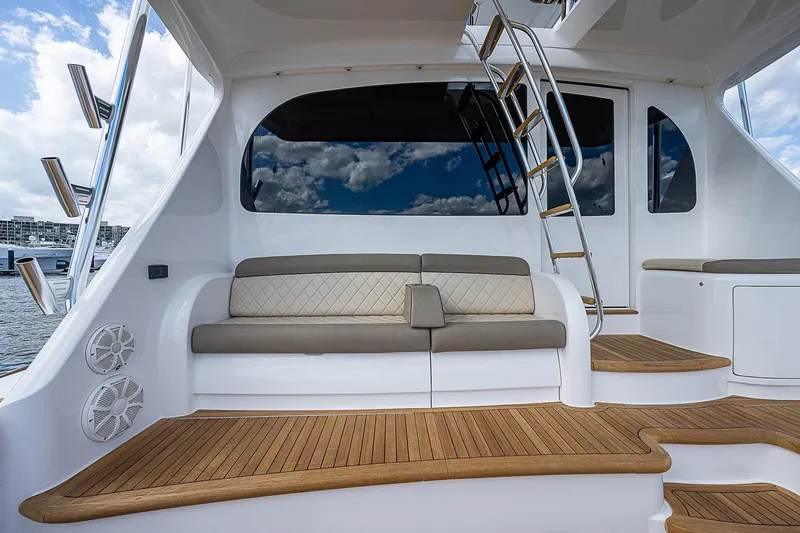 City Hands Yacht Photos Pics 2020 Viking 68 Convertible yacht with teak deck and cushioned seating.