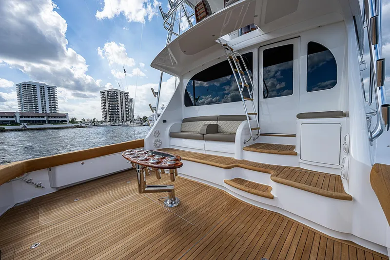 City Hands Yacht Photos Pics 2020 Viking 68 Convertible yacht deck with seating and waterfront view.