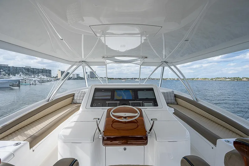 City Hands Yacht Photos Pics 2020 Viking 68 Convertible yacht helm station with panoramic water view.