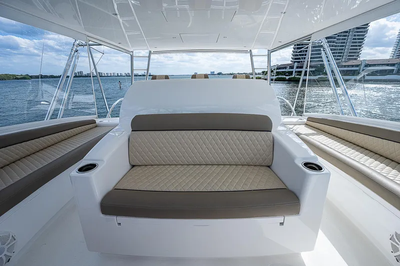City Hands Yacht Photos Pics 2020 Viking 68 Convertible yacht interior seating area with ocean view.