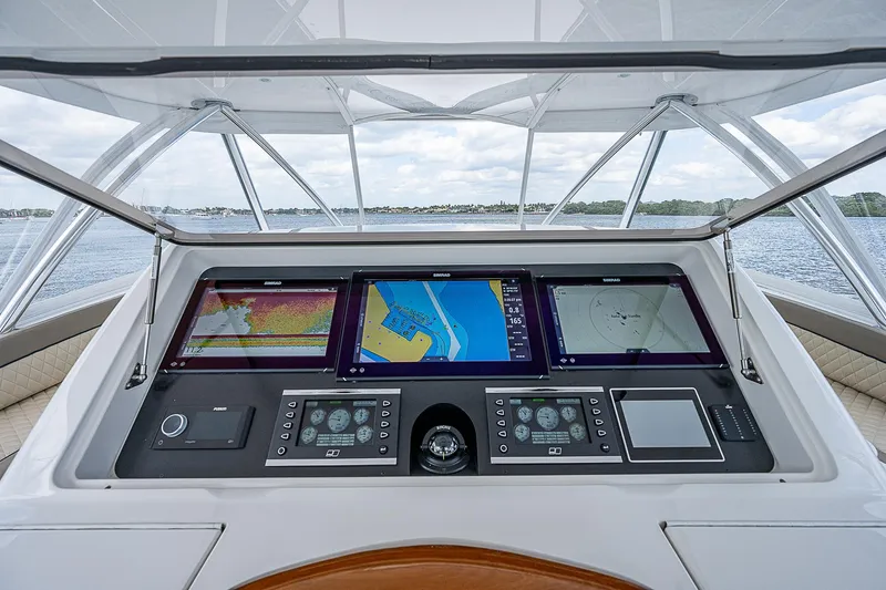 City Hands Yacht Photos Pics Control panel of a 2020 Viking 68 Convertible yacht with navigation screens.