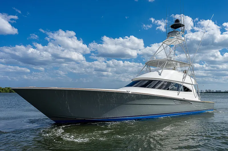 City Hands Yacht Photos Pics 2020 Viking 68 Convertible yacht on water under blue sky with clouds.