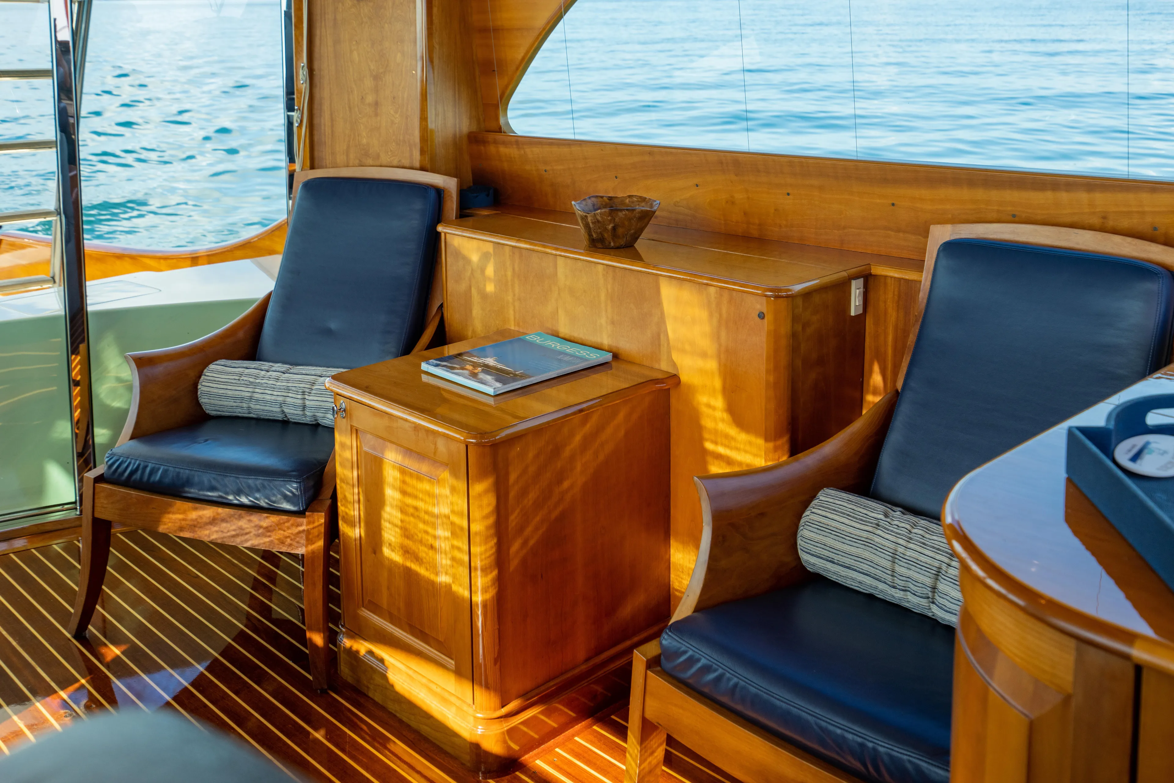 Three Aces Yacht Photos Pics Luxurious 2007 Hinckley Talaria 55 FB yacht interior with elegant wood and leather seating.