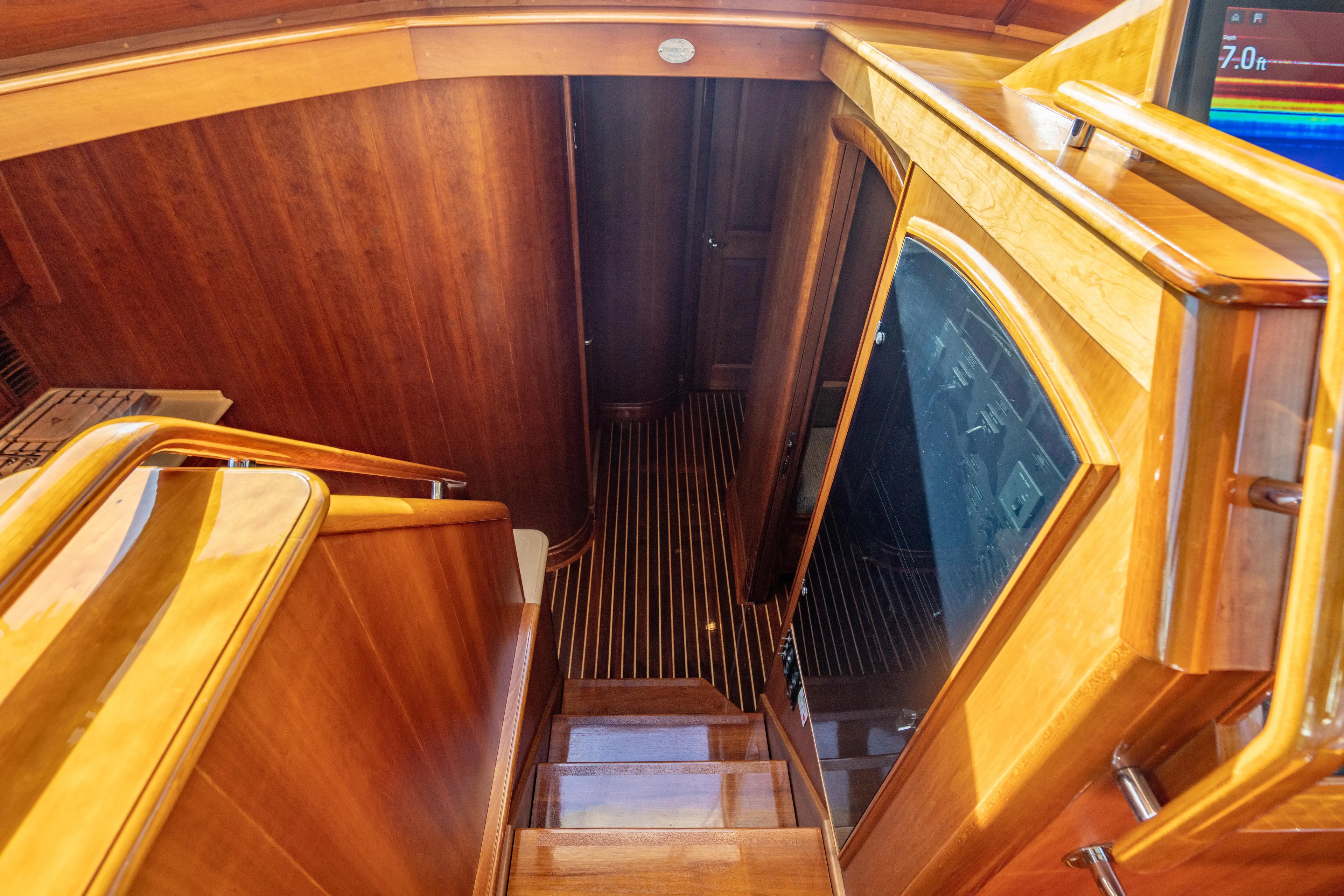 Three Aces Yacht Photos Pics Luxurious wooden interior of 2007 Hinckley Talaria 55 FB yacht staircase.