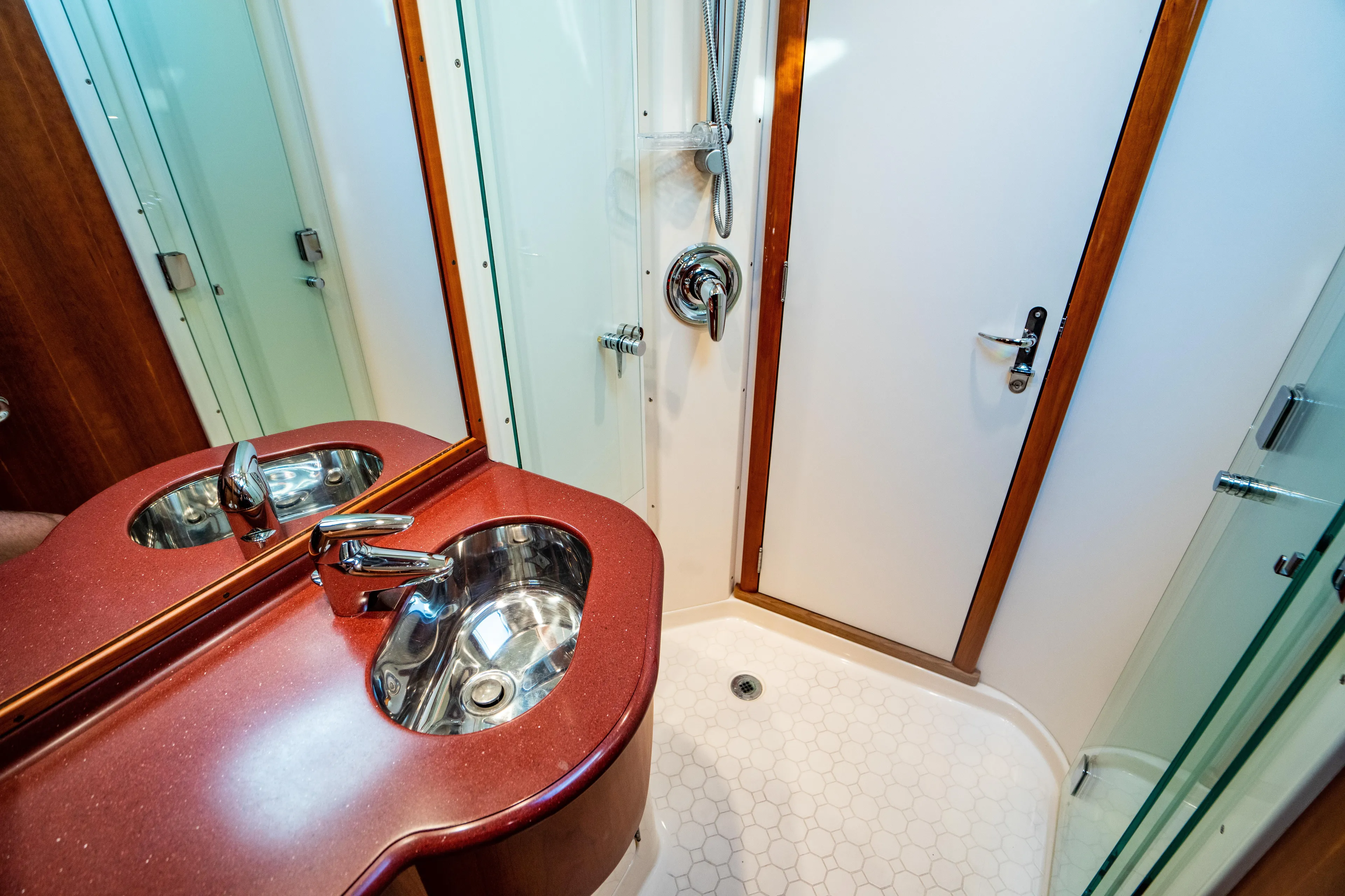 Three Aces Yacht Photos Pics Luxurious bathroom in 2007 Hinckley Talaria 55 FB yacht with modern fixtures.