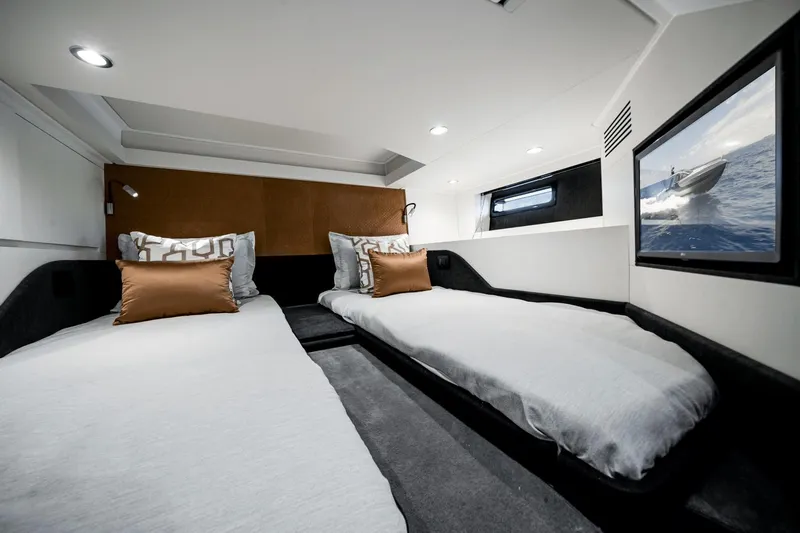  Yacht Photos Pics Luxurious cabin interior of 2025 Azimut Verve 48 yacht with twin beds.