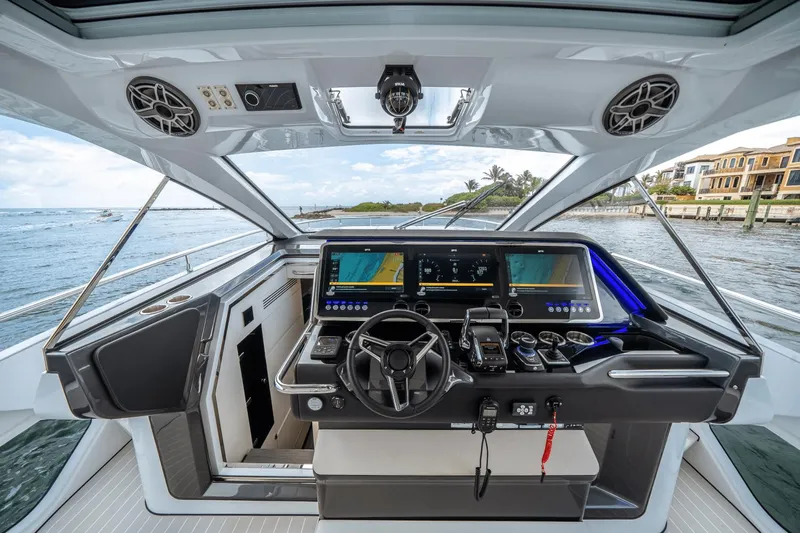  Yacht Photos Pics 2025 Azimut Verve 48 yacht cockpit with advanced navigation system and ocean view.