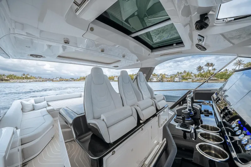  Yacht Photos Pics Luxurious interior of 2025 Azimut Verve 48 yacht with modern seating and control panel.