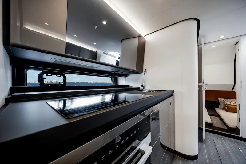  Yacht Photos Pics Modern kitchen interior of 2025 Azimut Verve 48 yacht, featuring sleek design and luxury amenities.