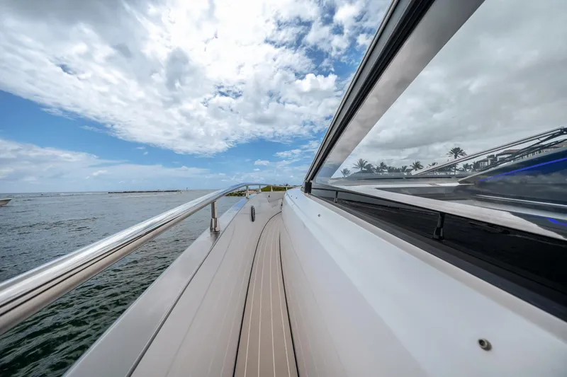  Yacht Photos Pics 2025 Azimut Verve 48 yacht deck with ocean view and cloudy sky.