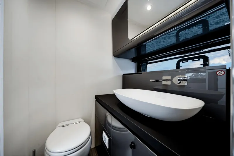  Yacht Photos Pics Modern bathroom interior on 2025 Azimut Verve 48 yacht, featuring sleek design and elegant fixtures.