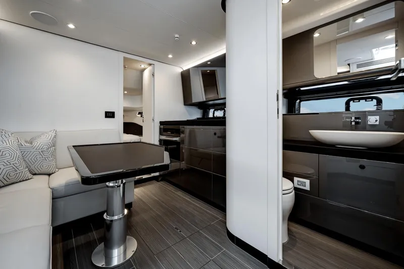  Yacht Photos Pics Luxurious interior of 2025 Azimut Verve 48 yacht with modern kitchen and seating area.