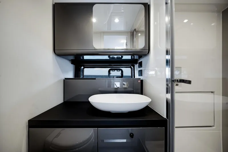  Yacht Photos Pics Modern bathroom interior of 2025 Azimut Verve 48 yacht with sleek design.