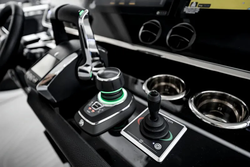  Yacht Photos Pics Control panel of 2025 Azimut Verve 48 yacht, featuring advanced navigation controls and cup holders.