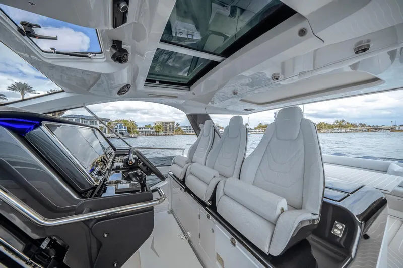  Yacht Photos Pics Interior of 2025 Azimut Verve 48 yacht with luxurious seating and modern controls.