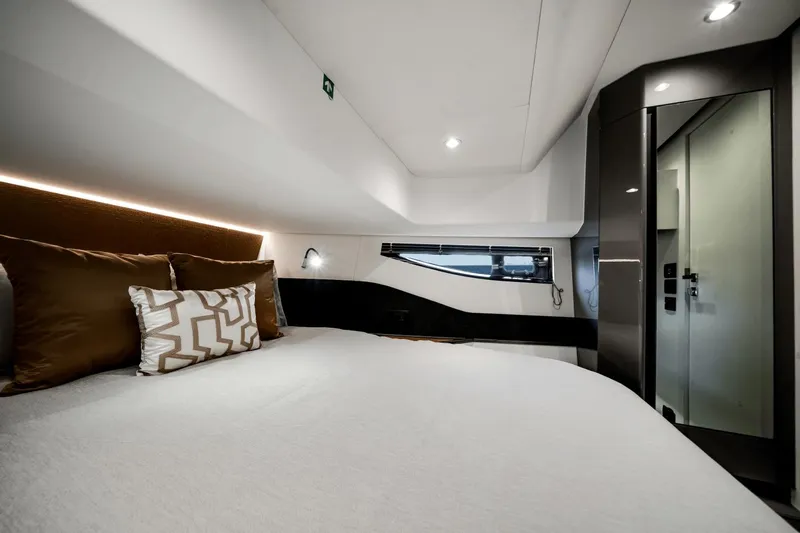  Yacht Photos Pics Luxurious bedroom interior of 2025 Azimut Verve 48 yacht with modern design.