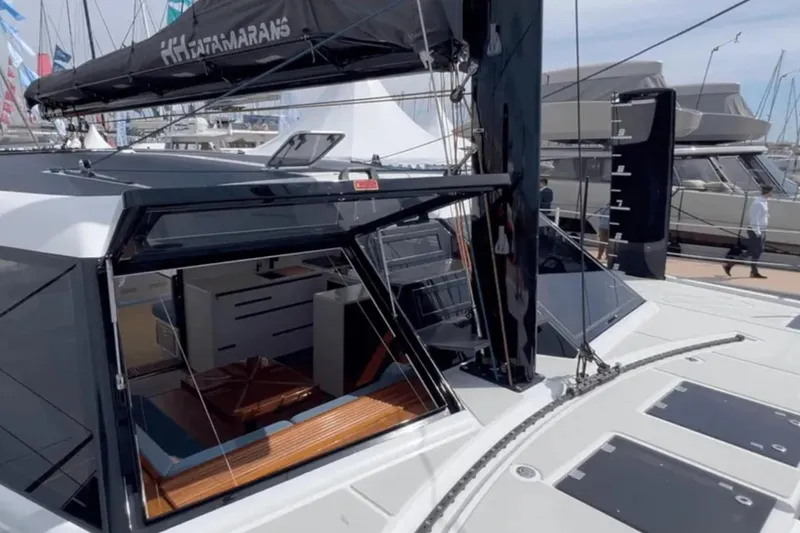 Hoku'au Yacht Photos Pics 2025 HH Catamarans HH44 yacht with sleek design and modern interior at a boat show.