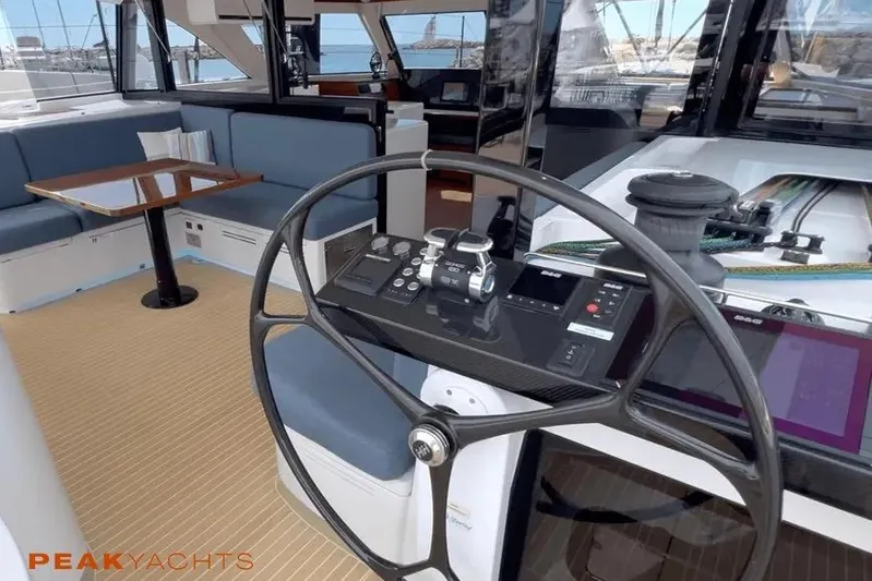 Hoku'au Yacht Photos Pics 2025 HH Catamarans HH44 yacht interior with steering wheel and seating area.