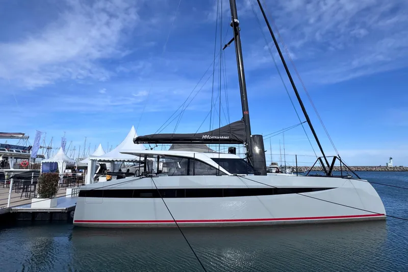 Hoku'au Yacht Photos Pics 2025 HH Catamarans HH44 docked at marina under clear blue sky.