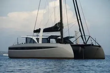 Hoku'au Yacht Photos Pics 2025 HH Catamarans HH44 sailing on calm waters, showcasing sleek design and modern features.