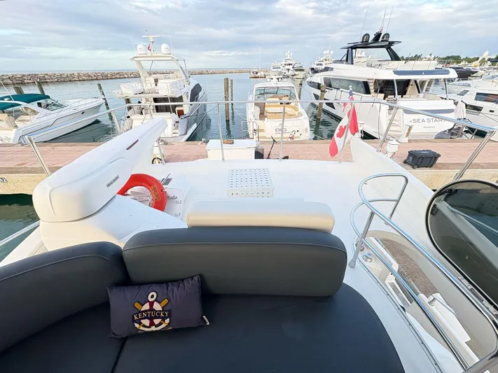  Yacht Photos Pics Azimut 62 Flybridge 2004 yacht docked at marina, featuring spacious deck and seating area.