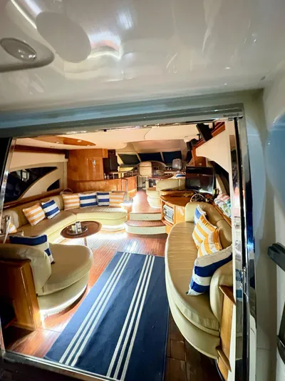  Yacht Photos Pics Luxurious interior of a 2004 Azimut 62 Flybridge yacht with elegant seating and decor.