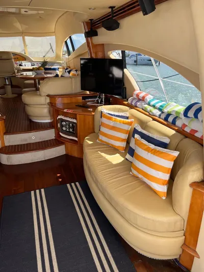  Yacht Photos Pics Luxurious 2004 Azimut 62 Flybridge interior with plush seating and nautical decor.