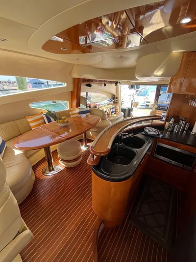  Yacht Photos Pics Luxurious interior of a 2004 Azimut 62 Flybridge yacht with elegant wood finishes.