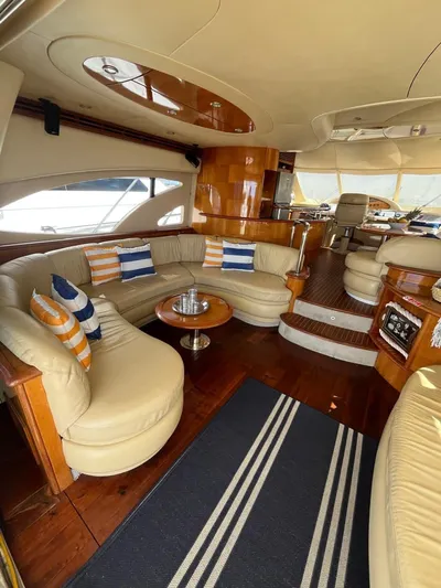  Yacht Photos Pics Luxurious interior of a 2004 Azimut 62 Flybridge yacht with elegant seating and decor.
