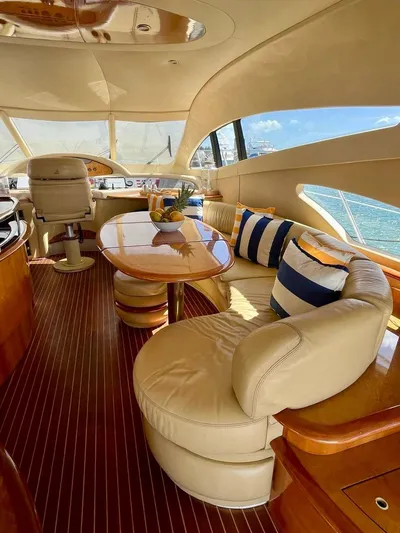  Yacht Photos Pics Luxurious interior of a 2004 Azimut 62 Flybridge yacht with elegant seating and ocean view.