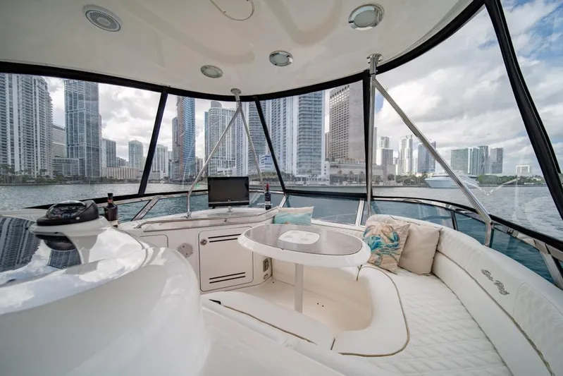  Yacht Photos Pics Luxurious 2006 Sea Ray 52 Sedan Bridge yacht interior with city skyline view.