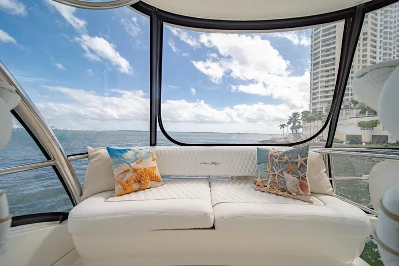  Yacht Photos Pics Luxurious interior of 2006 Sea Ray 52 Sedan Bridge yacht with scenic ocean view.