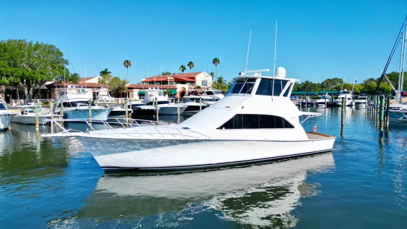 Escape Yacht Photos Pics 1998 Ocean Yachts 53 Super Sport in harbor on a sunny day.