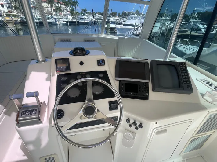 Escape Yacht Photos Pics 1998 Ocean Yachts 53 Super Sport helm station in marina.