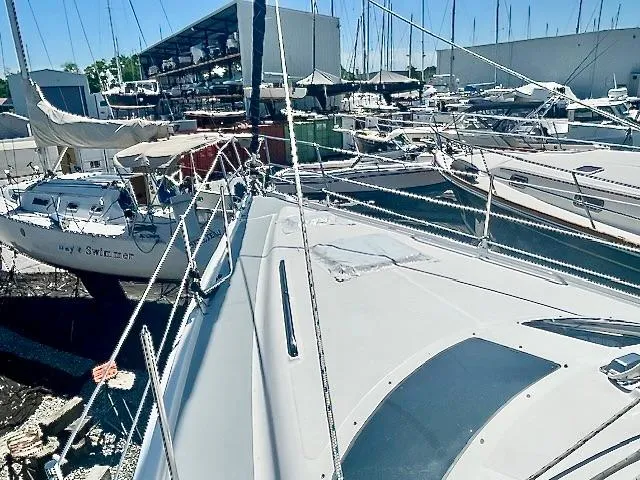 Gypsy Palace Yacht Photos Pics 2003 Hunter Passage 420 sailboat docked in a busy marina, surrounded by other vessels.
