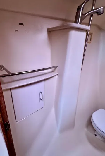 Gypsy Palace Yacht Photos Pics 2003 Hunter Passage 420 bathroom with white fixtures and compact design.