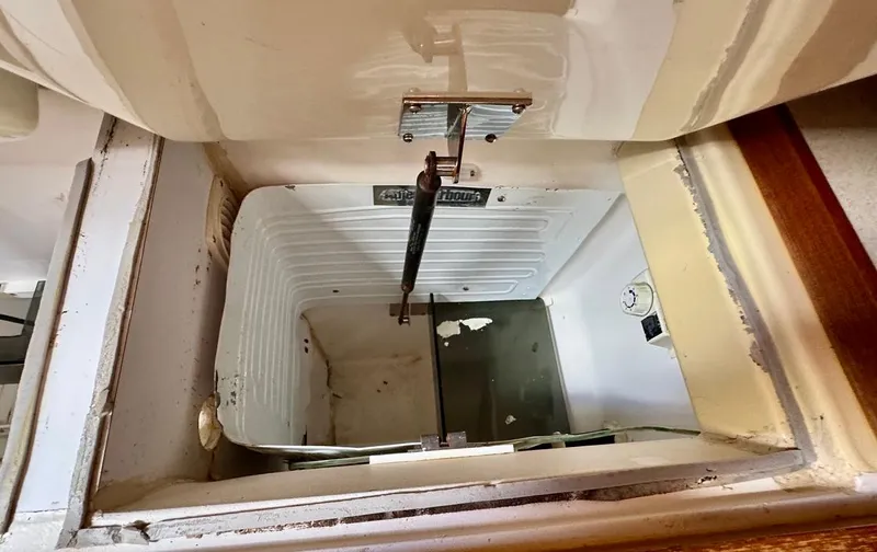 Gypsy Palace Yacht Photos Pics Open storage compartment in 2003 Hunter Passage 420 boat interior.