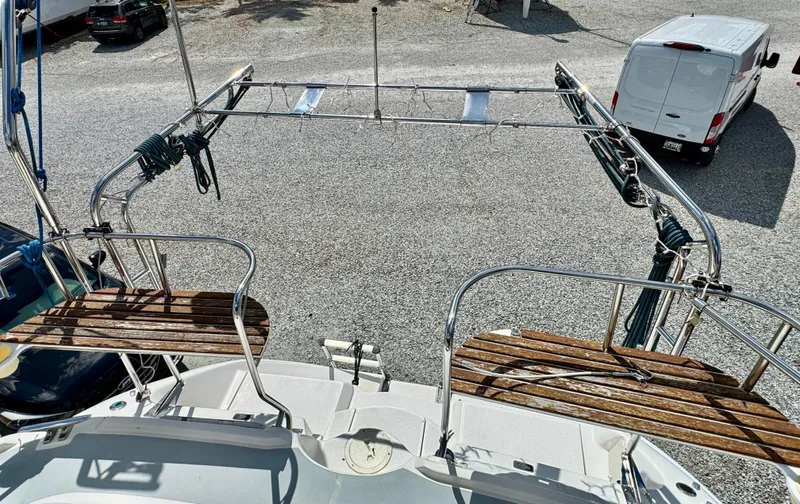 Gypsy Palace Yacht Photos Pics 2003 Hunter Passage 420 sailboat deck with wooden seating and metal railings.