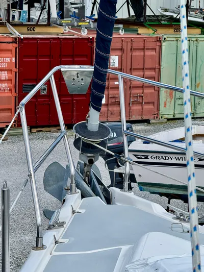 Gypsy Palace Yacht Photos Pics 2003 Hunter Passage 420 sailboat bow with anchor, docked near shipping containers.