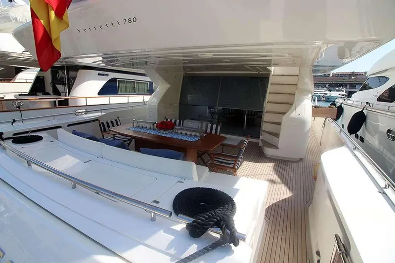  Yacht Photos Pics 2006 Ferretti Yachts 780 deck with dining area and staircase, docked at marina.