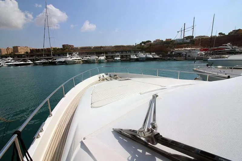  Yacht Photos Pics Bow view of 2006 Ferretti Yachts 780 docked in a marina.