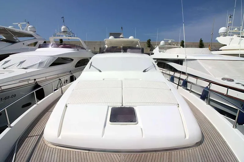  Yacht Photos Pics Luxury 2006 Ferretti Yachts 780 docked among other yachts under clear blue sky.