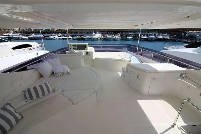  Yacht Photos Pics Luxurious 2006 Ferretti Yachts 780 deck with seating, overlooking marina.