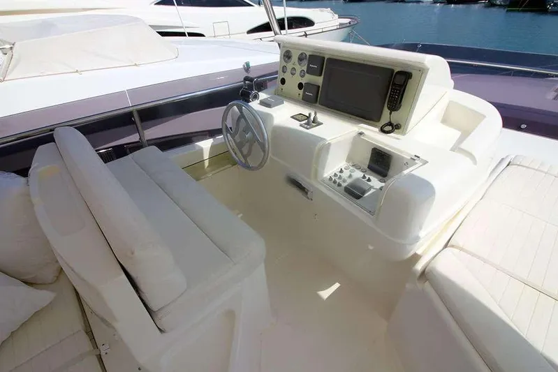  Yacht Photos Pics Cockpit of 2006 Ferretti Yachts 780 with modern navigation equipment and seating.