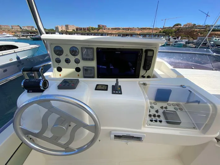  Yacht Photos Pics Helm of 2006 Ferretti Yachts 780 with navigation controls and steering wheel.