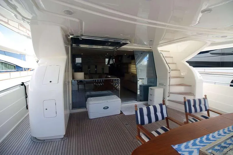  Yacht Photos Pics Luxury 2006 Ferretti Yachts 780 deck with seating and stairs, showcasing elegant design.