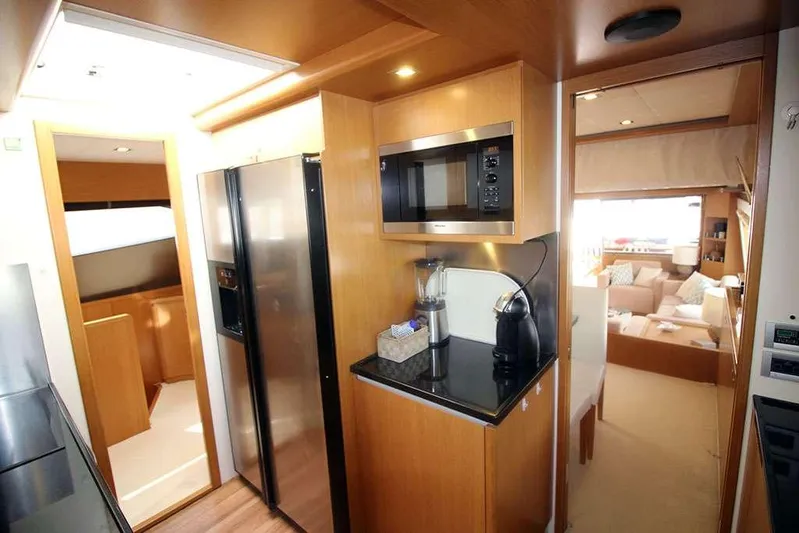  Yacht Photos Pics Luxurious kitchen interior of 2006 Ferretti Yachts 780 with modern appliances.