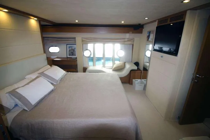  Yacht Photos Pics Luxurious bedroom interior of 2006 Ferretti Yachts 780 with modern decor and large windows.