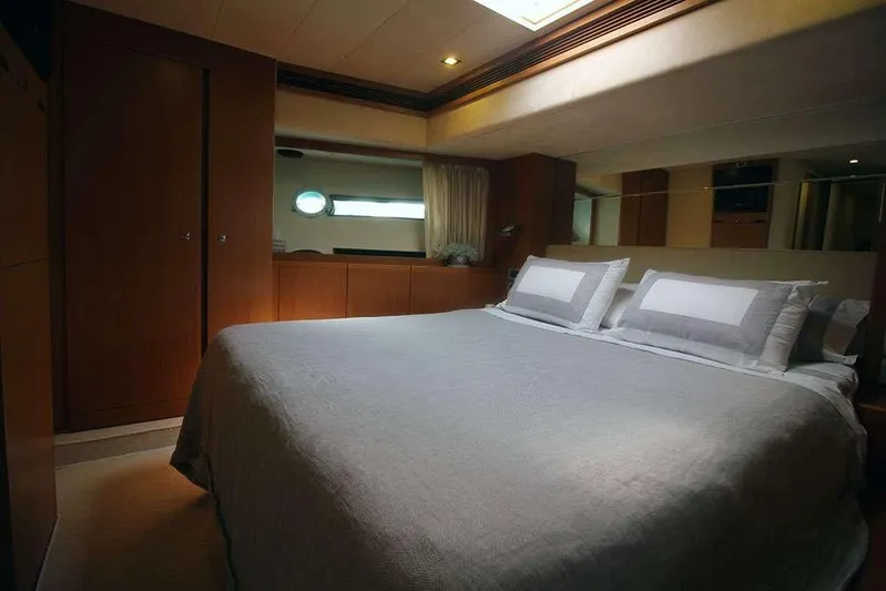  Yacht Photos Pics Luxurious bedroom interior of 2006 Ferretti Yachts 780 with elegant bedding and wood accents.