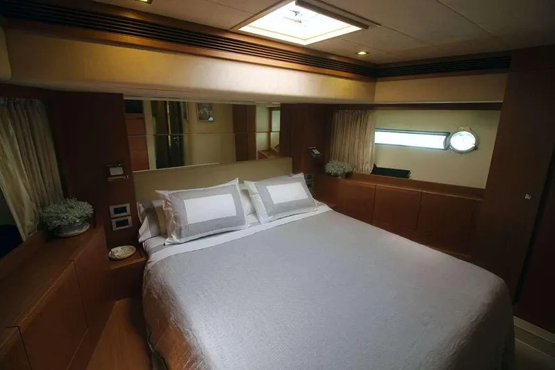  Yacht Photos Pics Luxurious bedroom interior of 2006 Ferretti Yachts 780 with elegant bedding and wood accents.